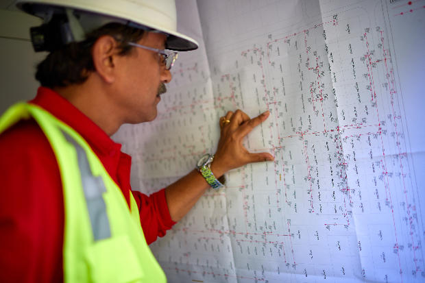 Worker looking at a paper